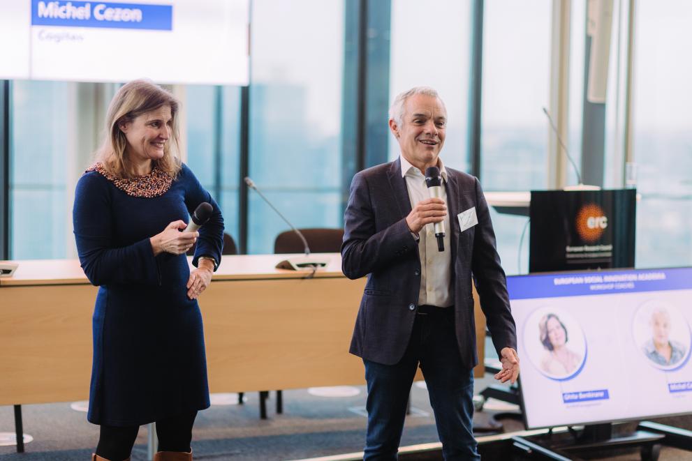 Michel Cezon, Certified Professional Coach for Technology Startups and European Commission, delivering a speech during the award ceremony, while EISMEA Head of Department Birgit Weidel listens attentively, engaged and entertained.